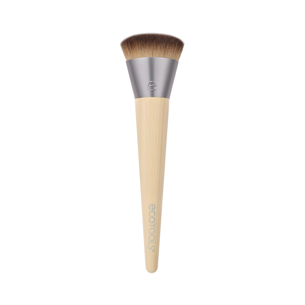Isolated complexion makeup brush with brown bristles and beige tapered handle