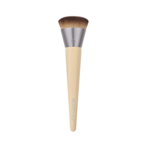 Isolated complexion makeup brush with brown bristles and beige tapered handle