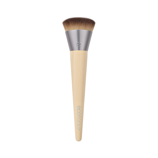 Isolated complexion makeup brush with brown bristles and beige tapered handle