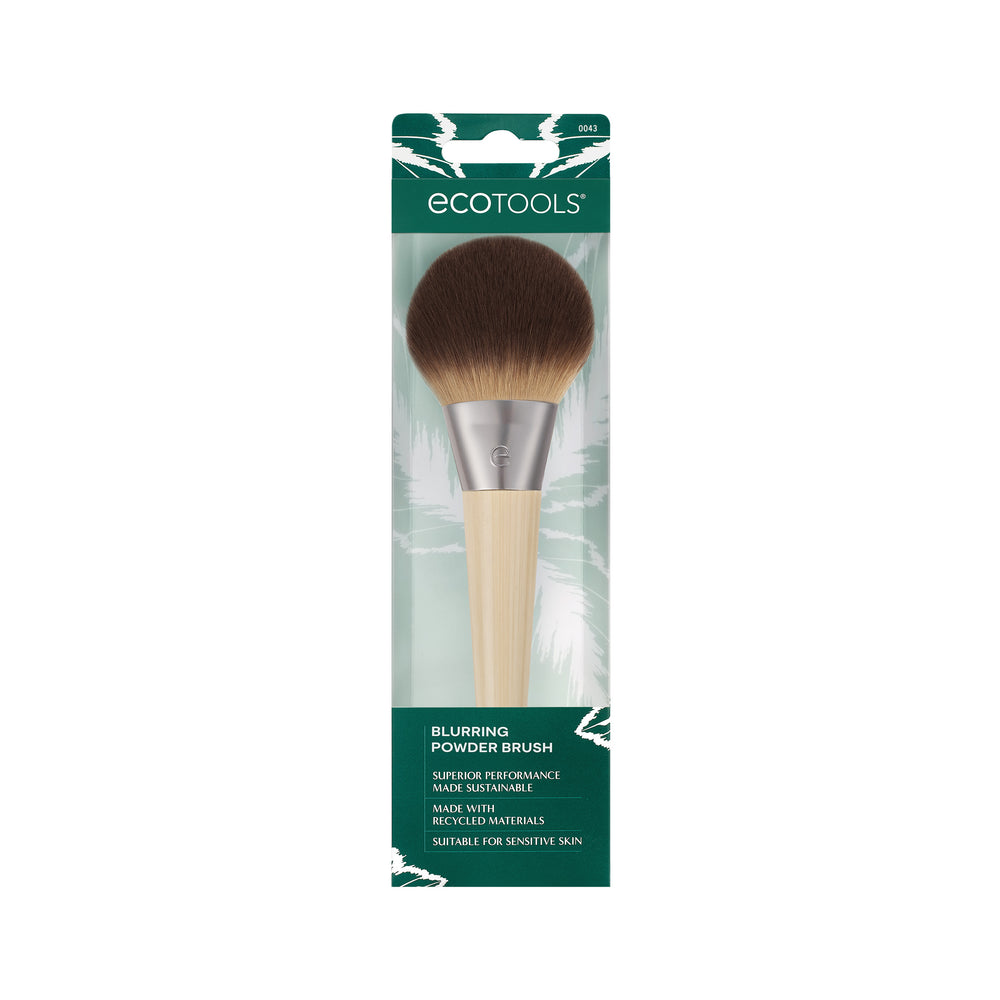 Powder blurring brush with rounded dark brown bristles and light bamboo handle