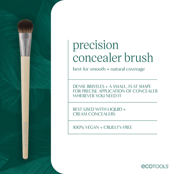Precision concealer brush standing upright with small dense bristles and silver ferrule