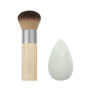 Makeup blending brush with light tan handle and light green teardrop sponge