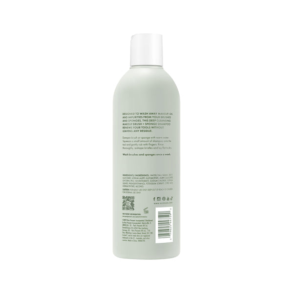 Sage-green makeup tool shampoo bottle with white cap, back label and barcode