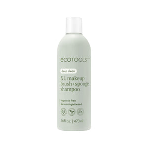Sage-green ECOTools deep clean XL makeup brush + sponge shampoo bottle, front view
