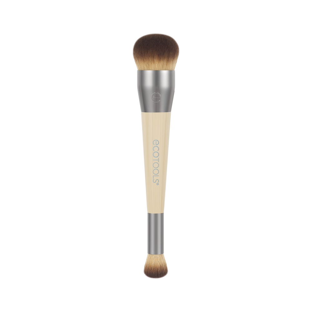 Makeup brush with rounded top brown bristles, silver ferrule, and beige handle