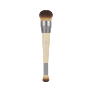 Makeup brush with rounded top brown bristles, silver ferrule, and beige handle