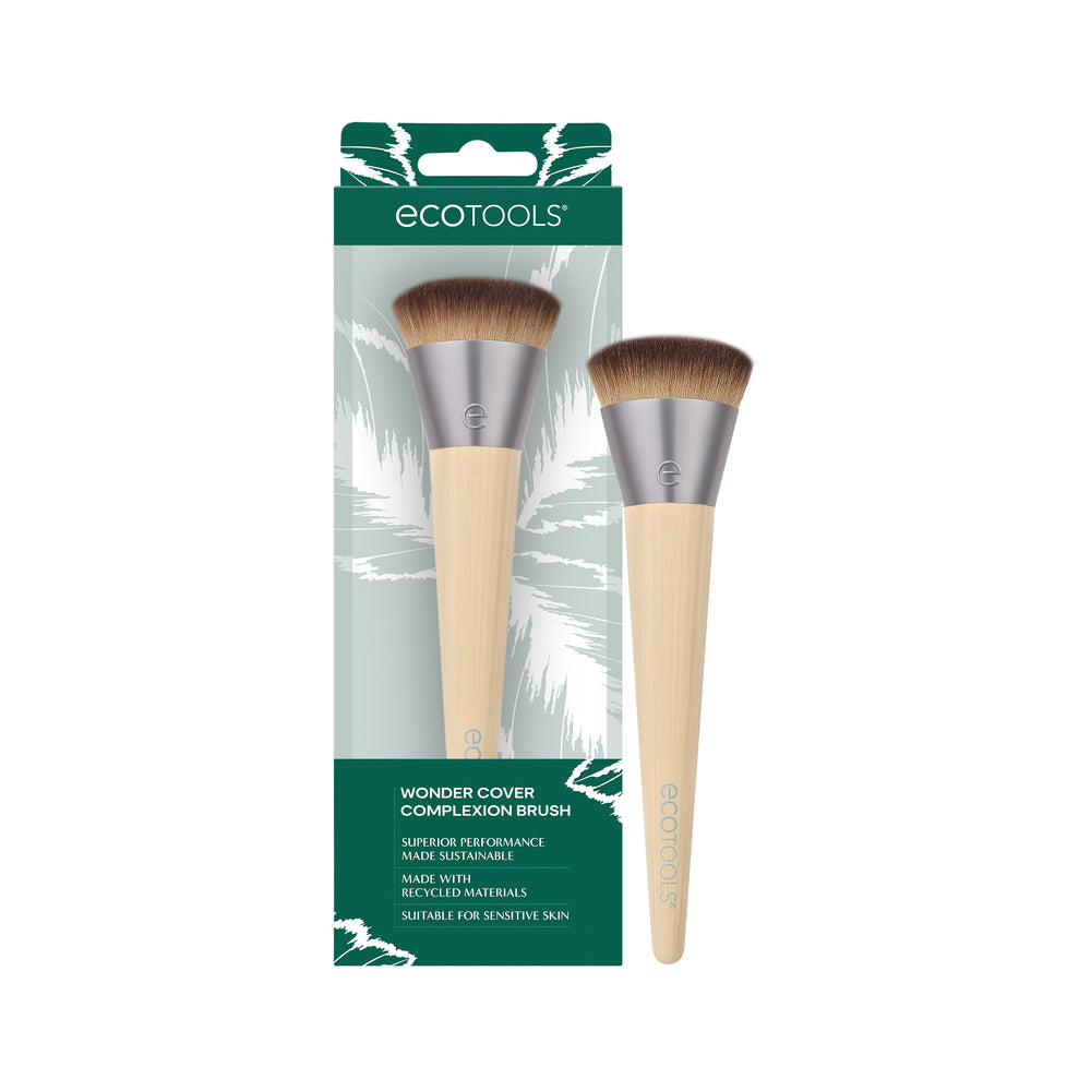 Isolated complexion makeup brush with brown bristles and beige tapered handle