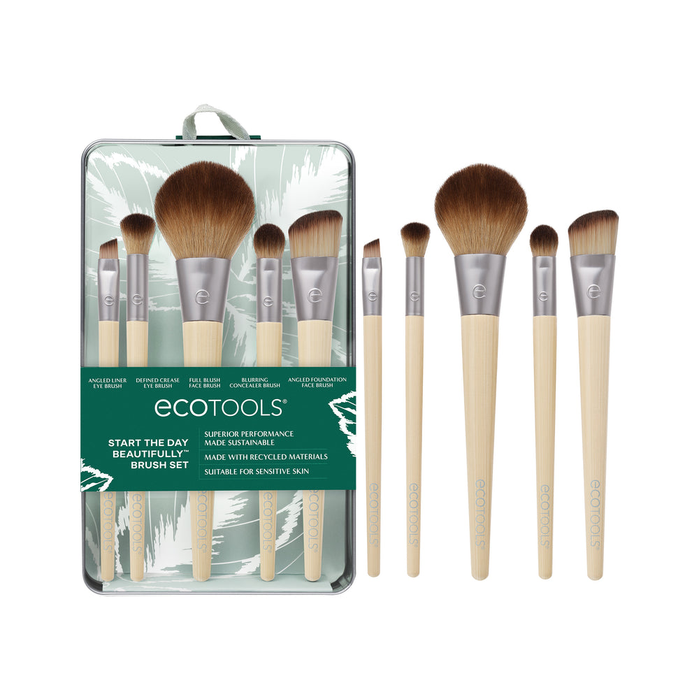 Makeup brush kit: five brushes with beige handles and brown bristles beside gray tin case