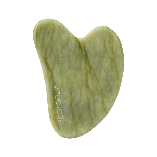 Heart-shaped jade gua sha tool, light green stone with swirled texture