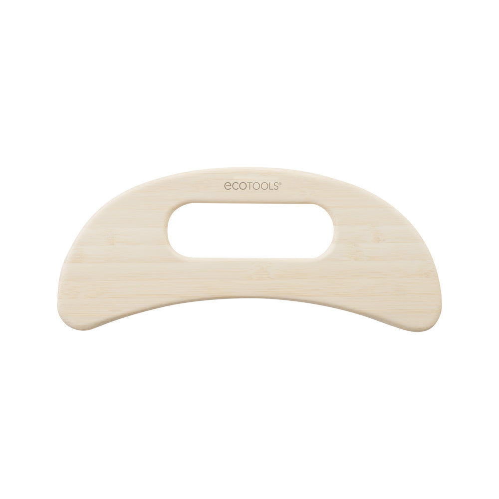 Light bamboo wooden body massager with curved handle and thumb cutout, ecotools brand.