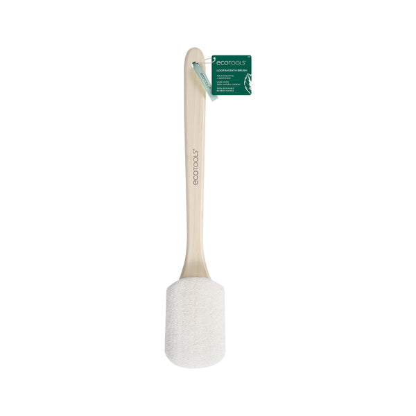 Loofah bath brush with white scrub head and light wood handle, green tag