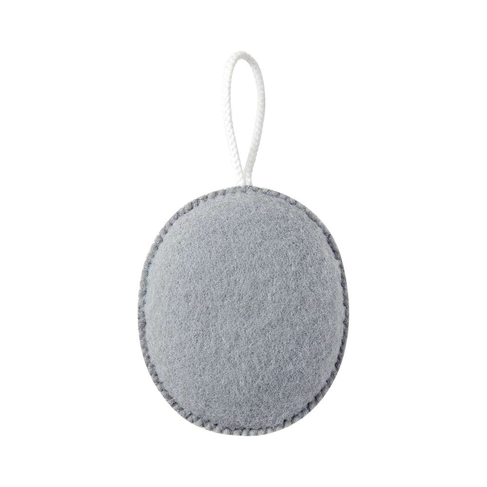 Grey oval exfoliating puff with hanging cord, textured scrubbing surface