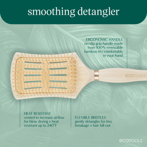 Detangling hair brush close-up with flexible pin bristles on cushioned rectangular pad