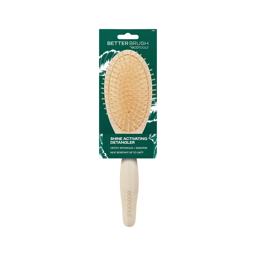 Oval paddle detangling hair brush with tan pins and a light wood grip handle