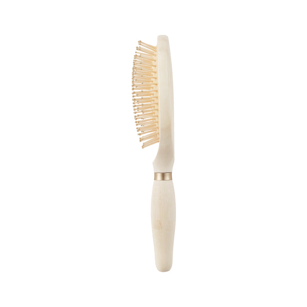 Light wood oval detangling hair brush with pins on a straight, pale handle