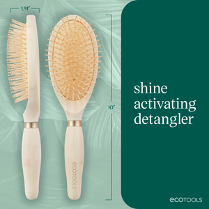 Two oval detangling hair brushes with pale handles and tan pin bristles