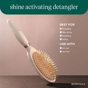 Shine activating detangler hair brush with oval pin head and curved light handle