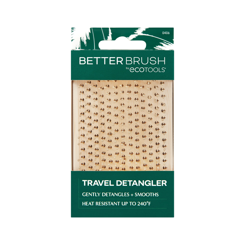 Light tan square detangling hair brush with dense round-tip bristles on bamboo backing