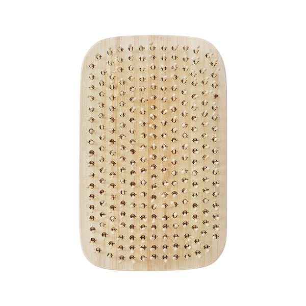 Light tan square detangling hair brush with dense round-tip bristles on bamboo backing