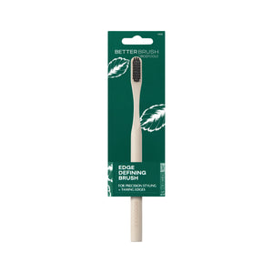 Edge defining brush in green retail package with bamboo handle and dark bristles
