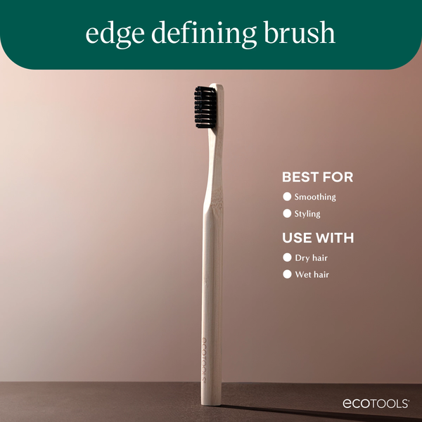 Edge defining brush with light bamboo handle and dark bristles, angled side view
