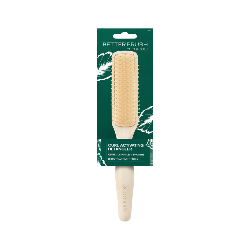 Light wood hair detangling brush with gold bristle pins and cushioned pad