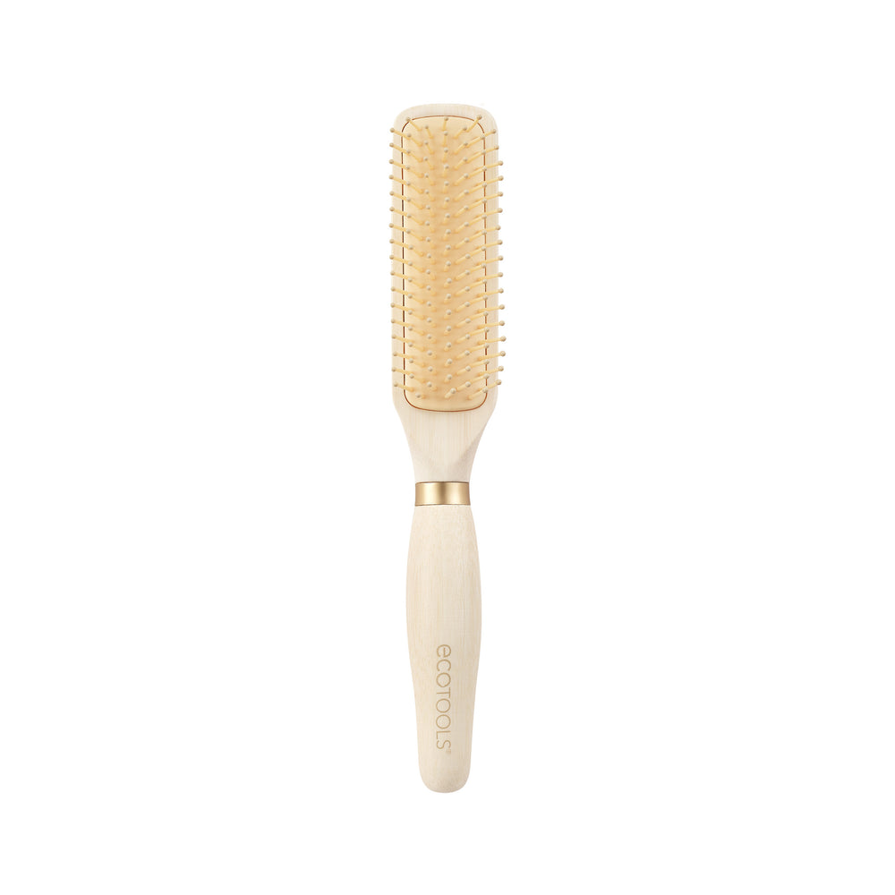 Light wood hair detangling brush with gold bristle pins and cushioned pad