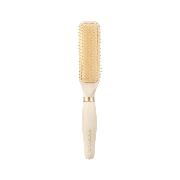 Light wood hair detangling brush with gold bristle pins and cushioned pad