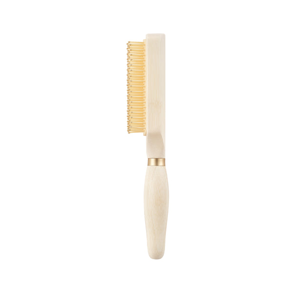 Light wood detangling hair brush with gold pins and cushioned base
