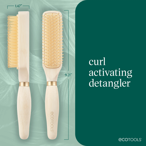 Two light wood detangling hair brushes with gold pin bristles