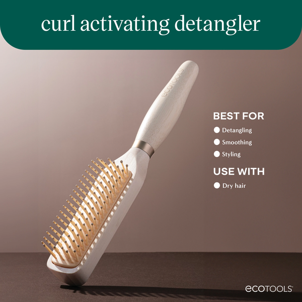Detangling brush with light wood handle and golden pin bristles