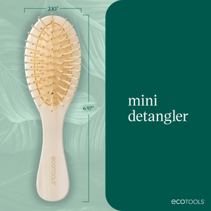 Mini detangler hair brush on blue graphic with size measurement box