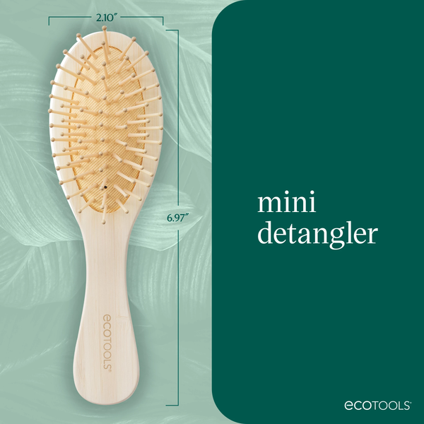 Mini detangler hair brush on blue graphic with size measurement box
