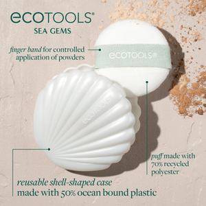 White shell-shaped case with mint-banded puff and round mirror, with net storage pouch