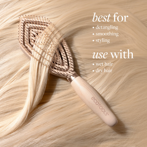 Fine hair detangler brush on blonde hair, showing pin rows on the bristle pad
