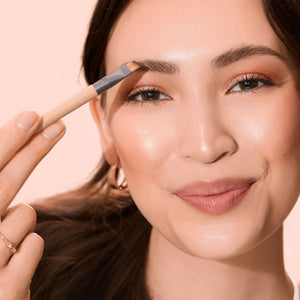 Fresh face makeup brush being used near the eye for blending