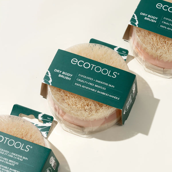 Assorted ECOTOOLS dry body brush packages showing round bristle heads