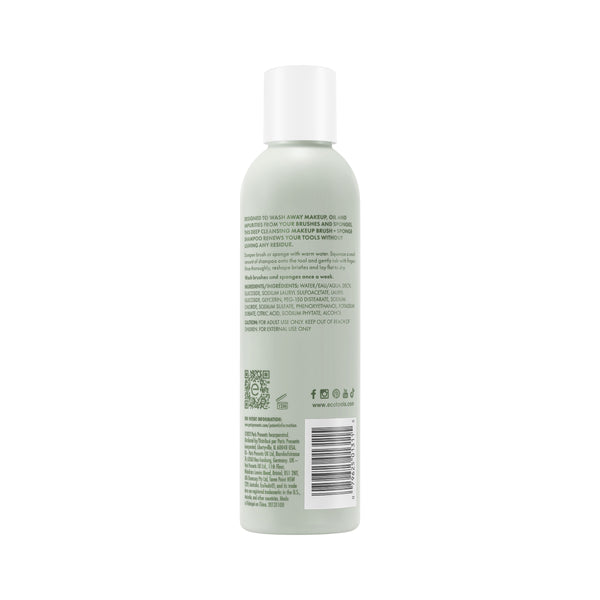 Makeup brush + sponge shampoo bottle with light green liquid, white cap, back label