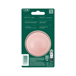 Packaged facial cleansing brush with pink round brush head in blister on green card