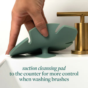 Suction makeup brush cleansing pad, teal silicone with raised bristle nubs
