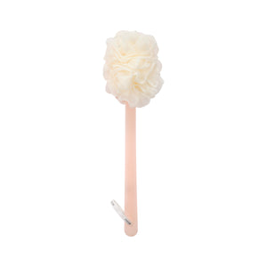 Cream loofah bath brush with ruffled puff head on slender light pink handle