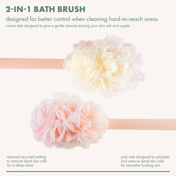 2-in-1 bath brush with cream and pink loofah puff heads on long handle