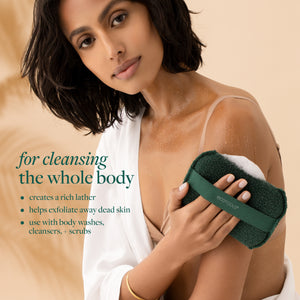 Dark green XL Body Buffer scrub held against the shoulder