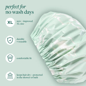 Mint XL shower cap shown with feature icons on packaging
