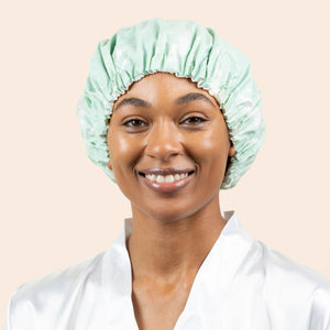 Mint shower cap worn on a model with gathered elastic edge