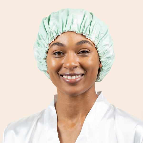 Mint shower cap worn on a model with gathered elastic edge