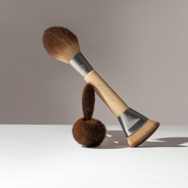 Dual-ended makeup brush with brown bristles, gray metal ends, and beige handle