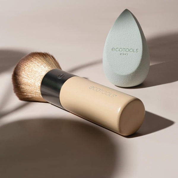 Makeup brush with bamboo handle and silver ferrule plus mint teardrop blending sponge