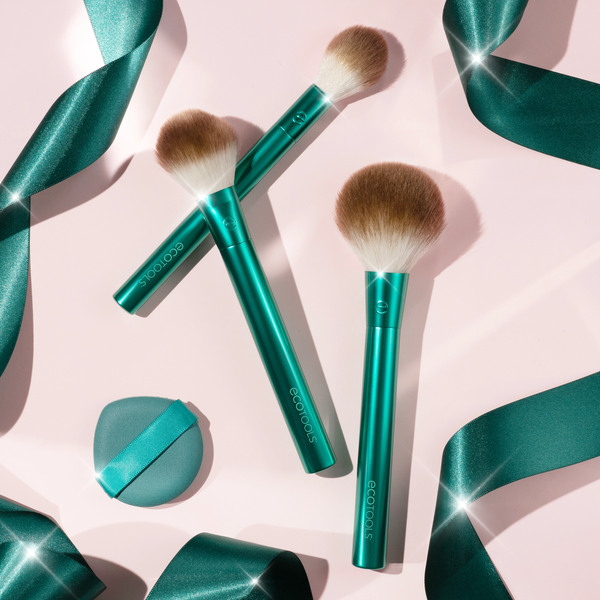 Four-piece brush set with teal handles, soft bristles, and teal blender sponge