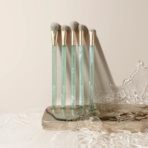 Sea Gems eye brush set with five brushes in a clear stand, green translucent handles